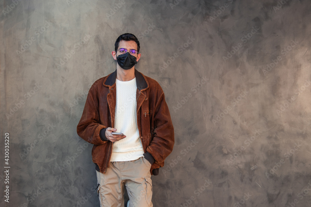 man with mask and mobile phone man with mask and mobile phone