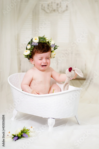 Little girl bathes in the bathroom