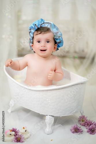 Little girl bathes in the bathroom