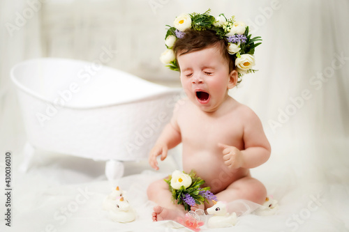 Little girl bathes in the bathroom