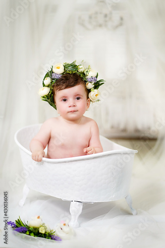 Little girl bathes in the bathroom