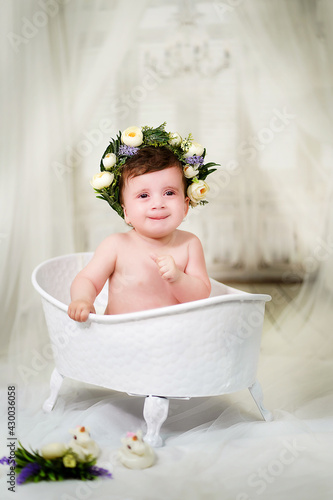 Little girl bathes in the bathroom