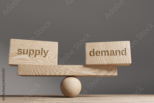 Supply and demand balance concept. Wooden cube block with words Supply and demand on seesaw. Life style concept