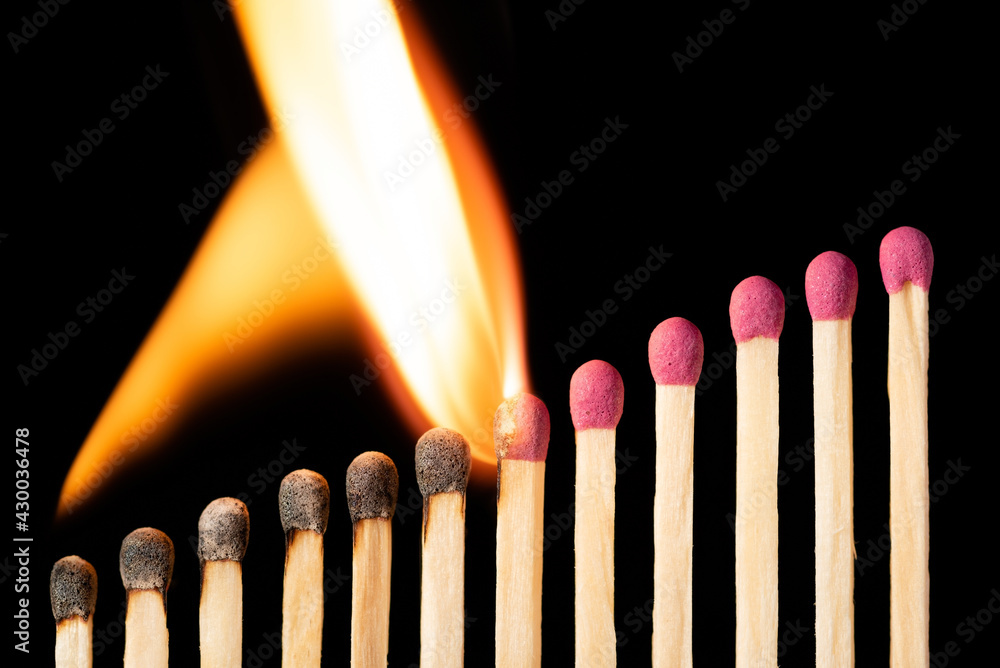 Fire spreading from lower to upper matches. Symbol of fast rising of anything. Fire spreading from lower to upper matches. Symbol of fast rising of anything.