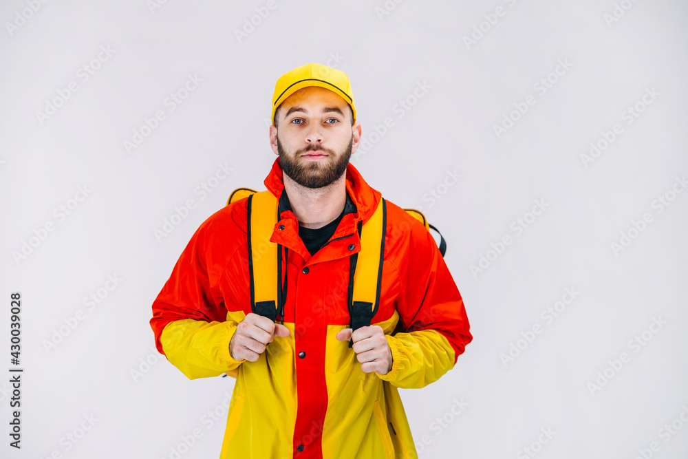 food delivery, courier with a yellow backpack on his back, in un food delivery, courier with a yellow backpack on his back, in un