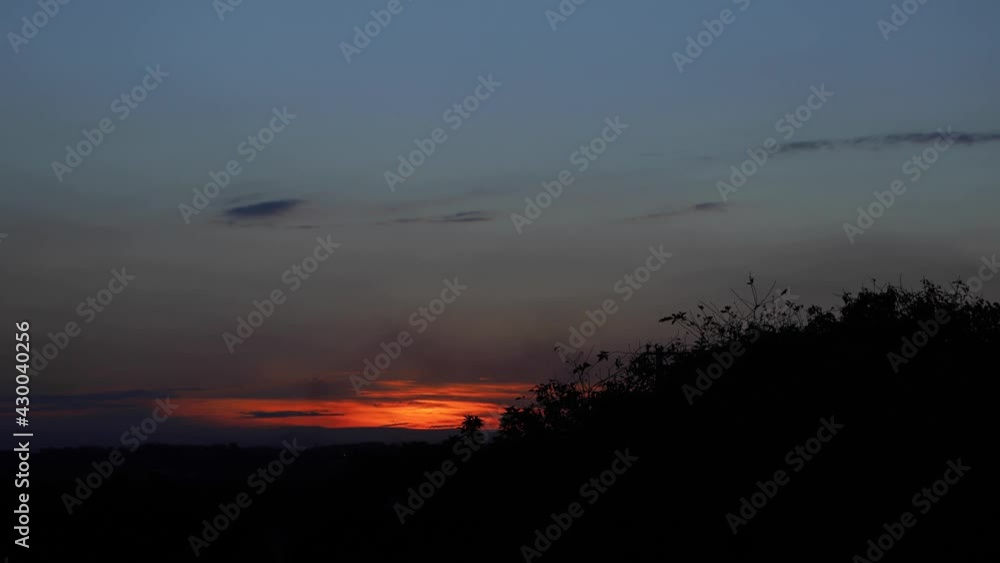 Timelapse with a sunset view highlighting the color orange and a sky ...