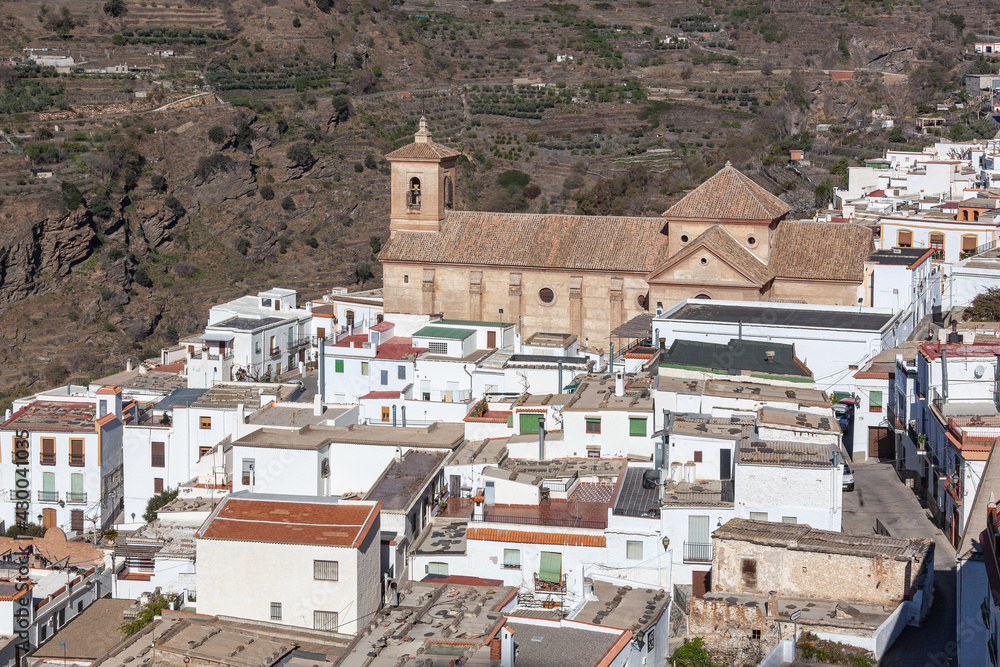 View across white village in mountains of the Sierra Nevada, Las Alpujarras, Granada Province, Spain
