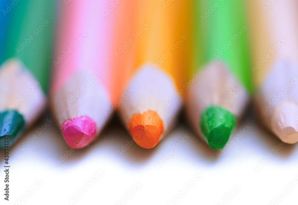 Colorful pencils in a row. Close-up