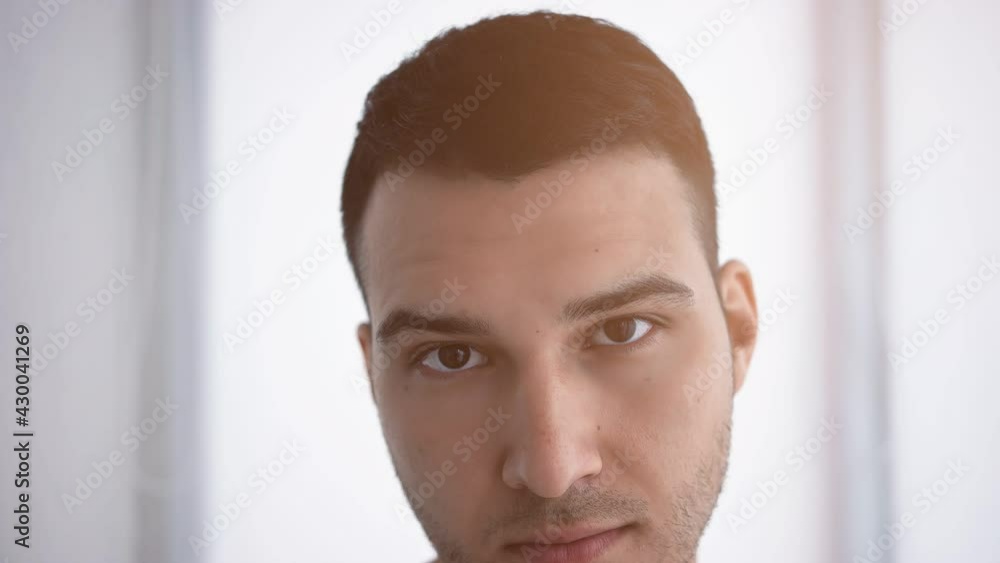 An attractive guy of Caucasian appearance looks An attractive guy of Caucasian appearance looks
