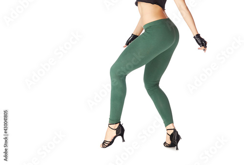 Legs of dancing woman on a white background