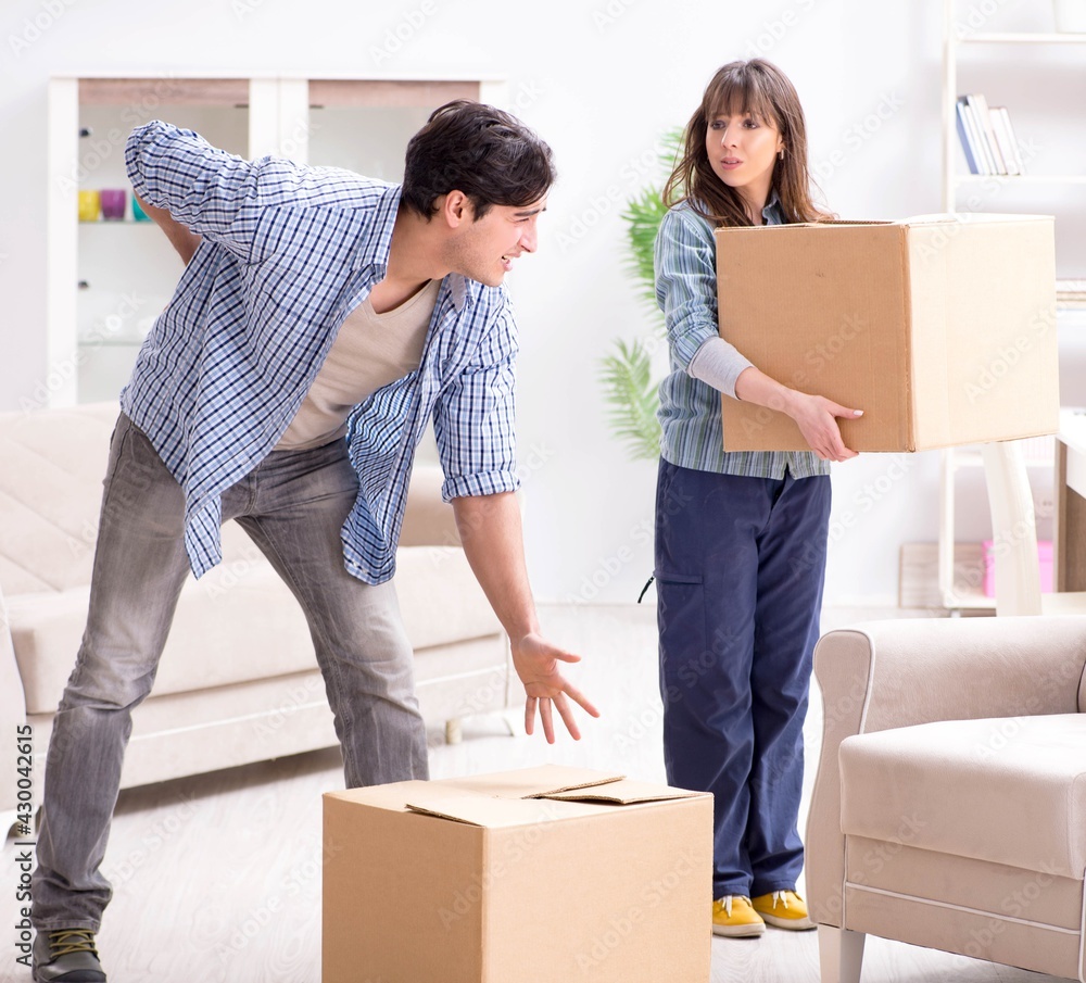 Young family moving in to new apartment after paying off mortgag Young family moving in to new apartment after paying off mortgag