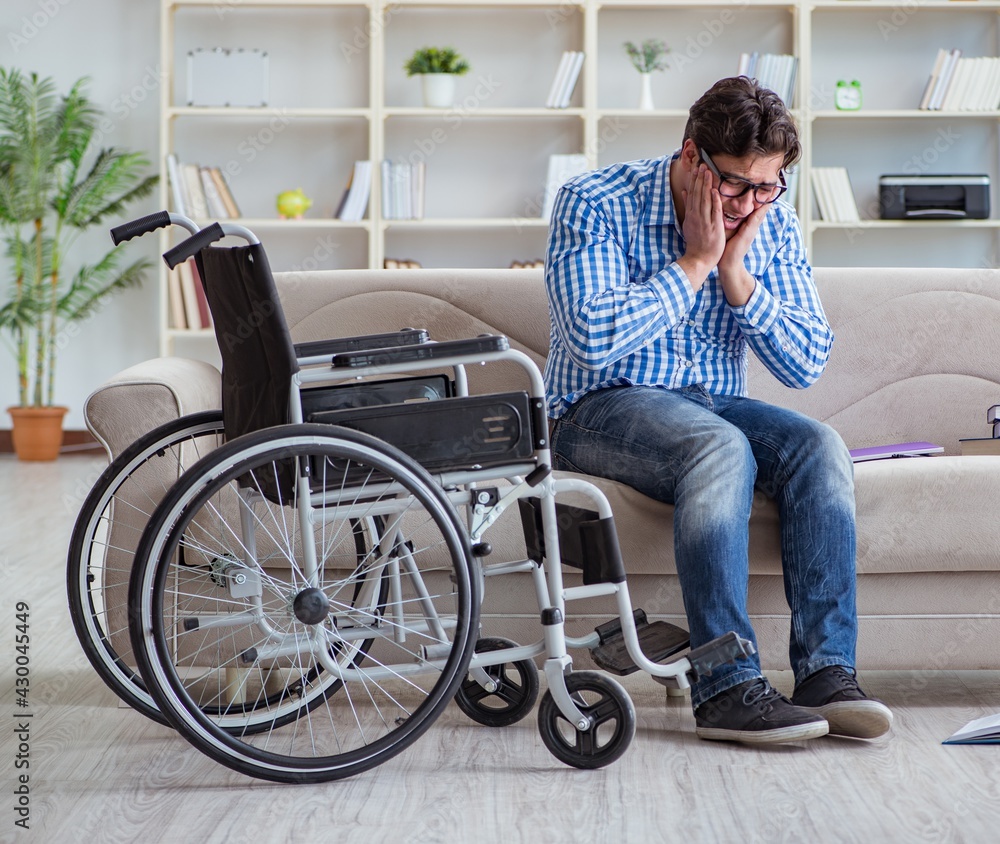 Young student on wheelchair in disability concept Young student on wheelchair in disability concept