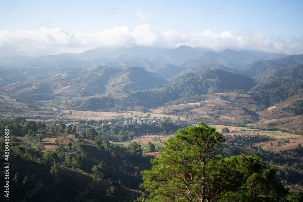 Rolling hills and farm lands with rice fields in Shan state, Myanmar Rolling hills and farm lands with rice fields in Shan state, Myanmar
