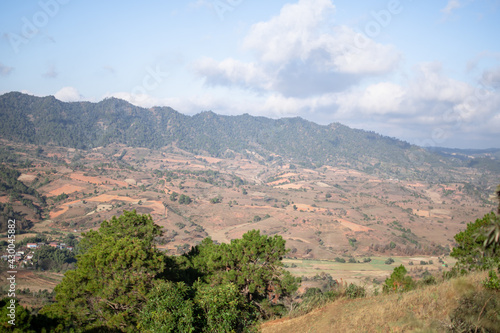 Rolling hills and farm lands with rice fields in Shan state, Myanmar