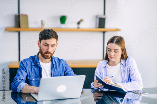 A freelance married couple working from home. A guy and a girl i