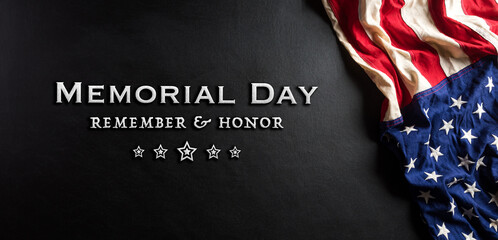 Happy memorial day concept made from american flag with text on black wooden background.