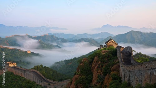 View of misty mountains and beacon towers, taken on the Great Wall of China photo