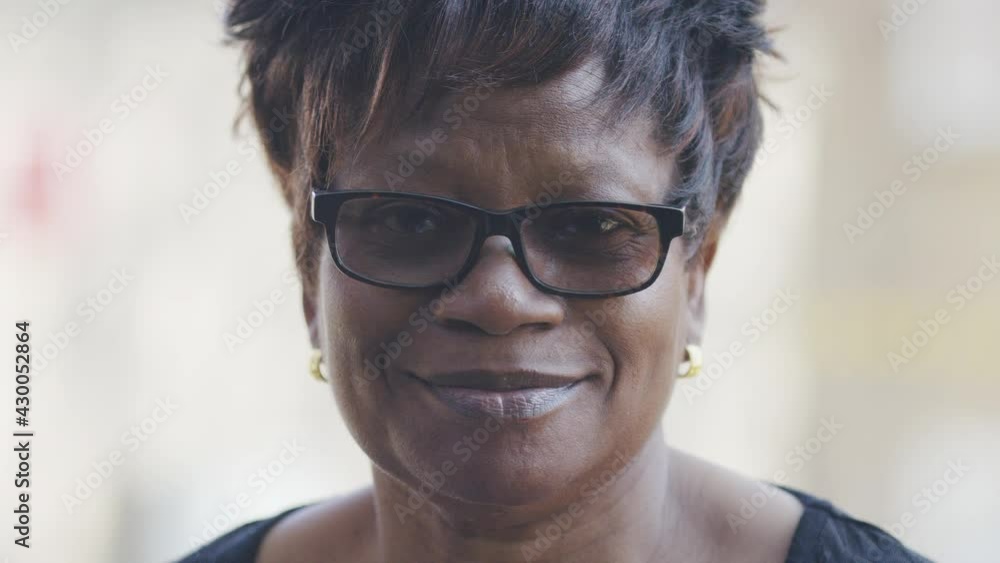 Portrait of older black female looking to camera and smiling Portrait of older black female looking to camera and smiling