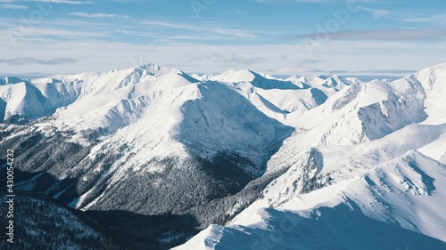 Winter Landscape With Snow Covered Mountains. Beautiful Cloudy Sky In The Background. High quality photo © CameraCraft