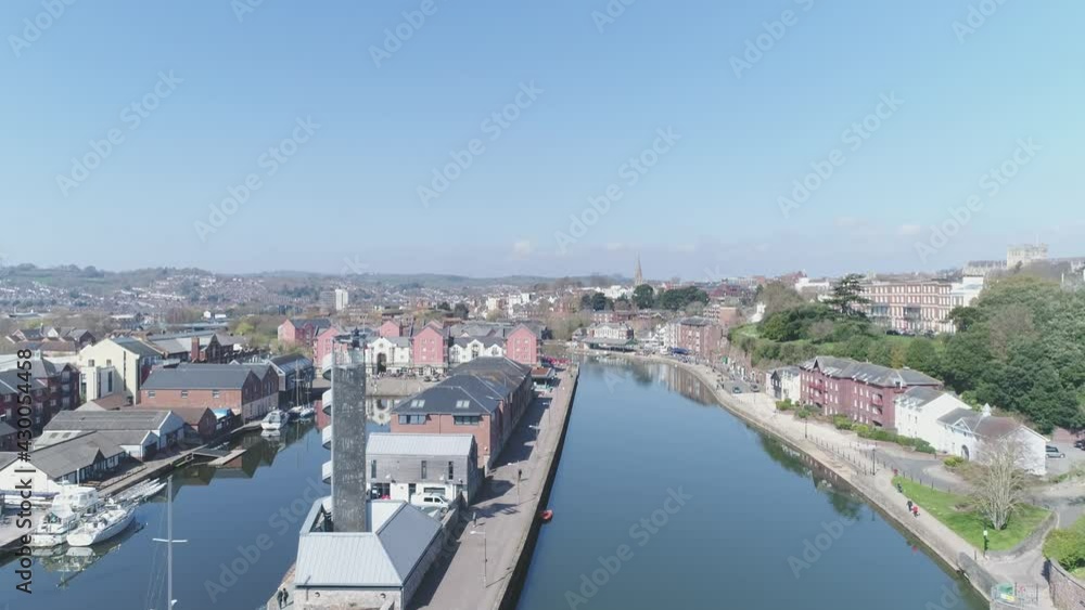Drone Asending over River Exe and Exeter Quay in Devon UK revealing the Exeter Skyline and Cathedral Drone Asending over River Exe and Exeter Quay in Devon UK revealing the Exeter Skyline and Cathedral
