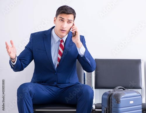 Man wairing to boarding in airport lounge room photo