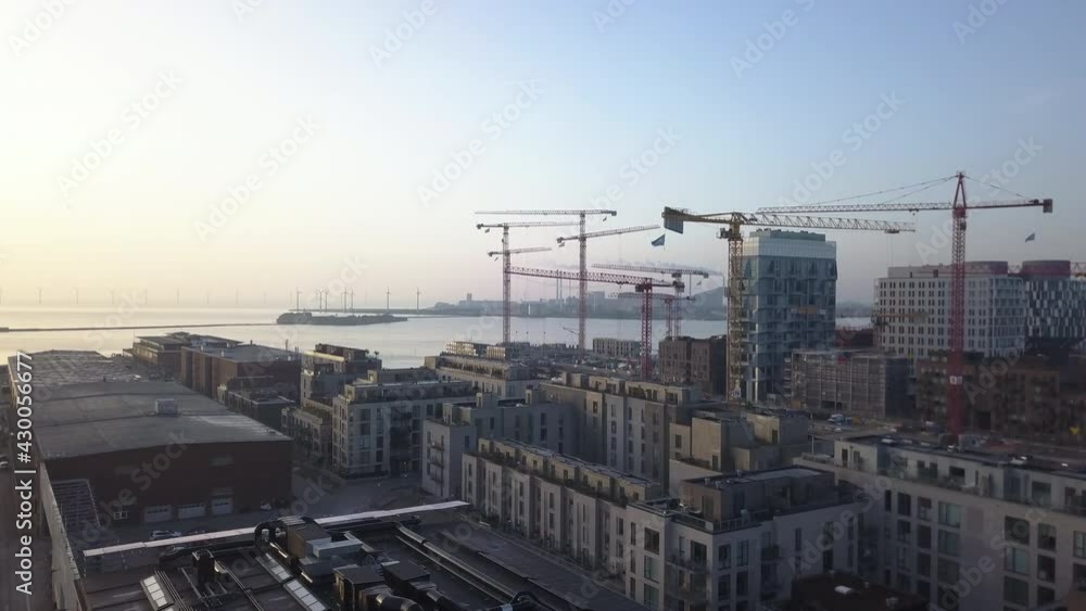 Aerial Drone, Skyline Reveal of Harbour City with Cranes and Windmills, Copenhagen, Denmark Aerial Drone, Skyline Reveal of Harbour City with Cranes and Windmills, Copenhagen, Denmark