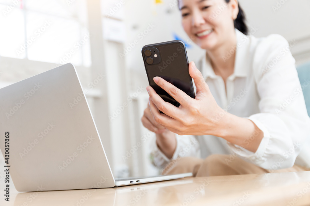 woman work using texting cell phone typing computer.student study education online learning.adult professional chatting on laptop,mobile contact us at Thinking business plan.connecting people concept woman work using texting cell phone typing computer.student study education online learning.adult professional chatting on laptop,mobile contact us at Thinking business plan.connecting people concept