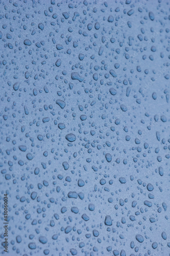 Blue abstract sky and raindrops on glass window Blue abstract sky and raindrops on glass window