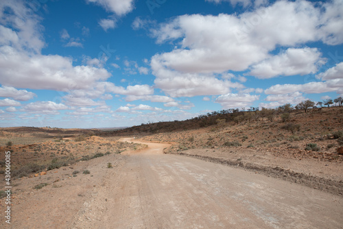 Australian rural landscape in a remote area of rural Outback. Dry harsh climate scenery with iconic red soil