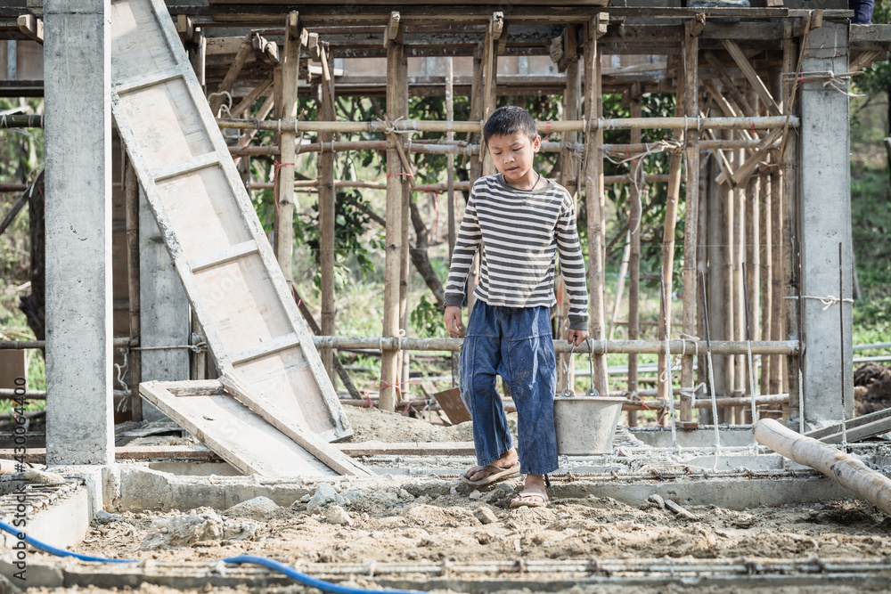 Children working at construction site for world day against child labor concept, Poverty, Human trafficking.