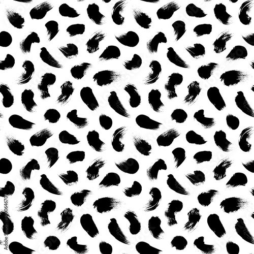 Big dots vector seamless pattern. Polka dot motif wallpaper. Abstract pattern of bold black shabby dots or spots on white background. Hand drawn black ornament for wallpaper, textile and fabric design