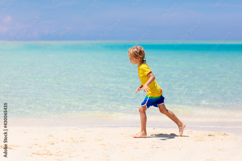 Kids playing on beach. Children play at sea. Kids playing on beach. Children play at sea.