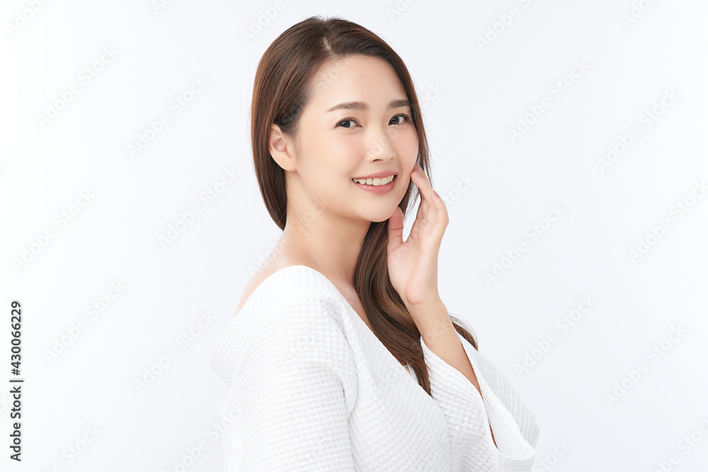 Beautiful young Asian woman wearing bathrobe on white background, Face care, Facial treatment, Cosmetology, beauty and spa Concept. Beautiful young Asian woman wearing bathrobe on white background, Face care, Facial treatment, Cosmetology, beauty and spa Concept.