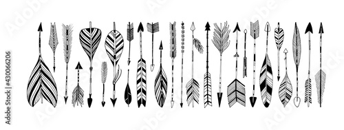 Rustic decorative arrows with feathers elements. Set of boho arrows with different tips and plumage. Hand drawn vintage vector collection. Vector black doodle elements isolated on white background
