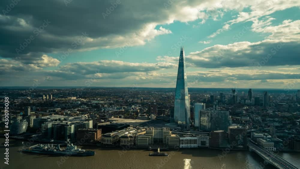 Time lapse shot of London Cityscape with River Thames and modern Shard Building during mystic clouds in motion. Time lapse shot of London Cityscape with River Thames and modern Shard Building during mystic clouds in motion.