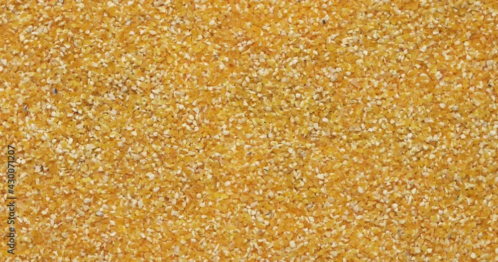 Closeup corn groats rotation, background, texture. Slow motion. Food background. Closeup corn groats rotation, background, texture. Slow motion. Food background.
