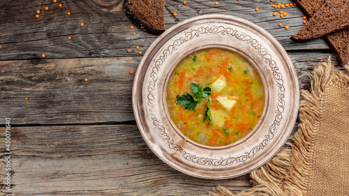 Red lentil soup. Traditional turkish or arabic lentil and vegetable spicy soup, healthy vegan food. Top view