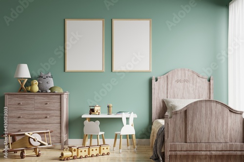 Picture frame on the green wall in the children's room with the bed by the window. Decorated with dolls and toys.3d rendering.