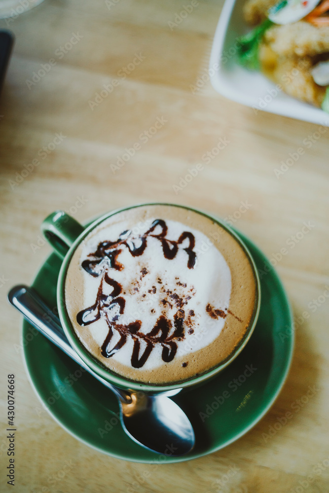 Hot Mocha - A Cup of Coffee with Beautiful Latte Art on wooden table background, Morning Breakfast
Hot Mocha - A Cup of Coffee with Beautiful Latte Art on wooden table background, Morning Breakfast