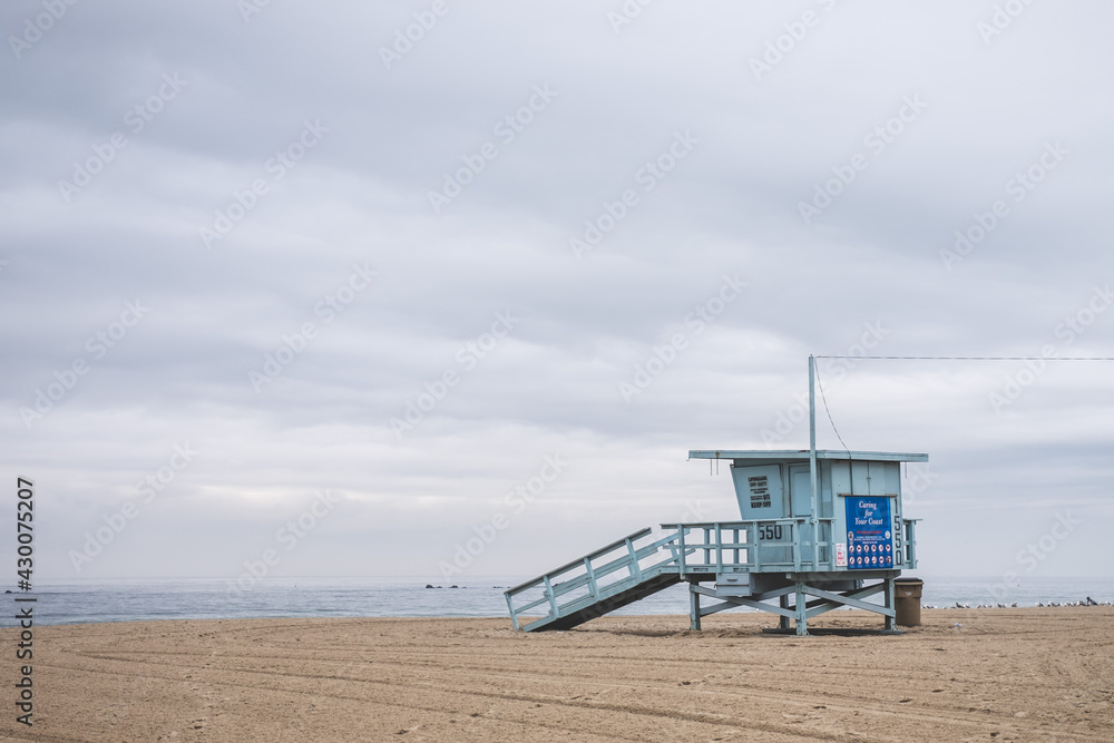 Empty Lifeguard Tower on the Beach Facing the Ocean Empty Lifeguard Tower on the Beach Facing the Ocean