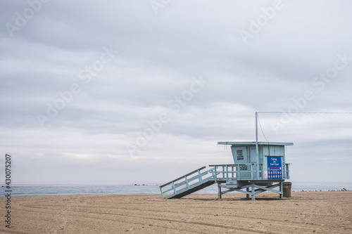Empty Lifeguard Tower on the Beach Facing the Ocean © Glen