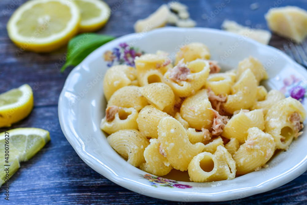 Italian home made pasta with lemon tuna fish, parmesan cheese and black pepper . Italian home made pasta with lemon tuna fish, parmesan cheese and black pepper .