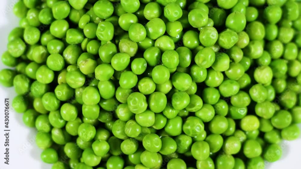 Close Up Green Peas Background Rotating. Macro Shot Fresh Organic Green Peas. Vegetable Harvest Healthy Eating. Beautiful Texture Close-up of Fresh Green Peas. Healthy Vegetarian food. Close Up Green Peas Background Rotating. Macro Shot Fresh Organic Green Peas. Vegetable Harvest Healthy Eating. Beautiful Texture Close-up of Fresh Green Peas. Healthy Vegetarian food.