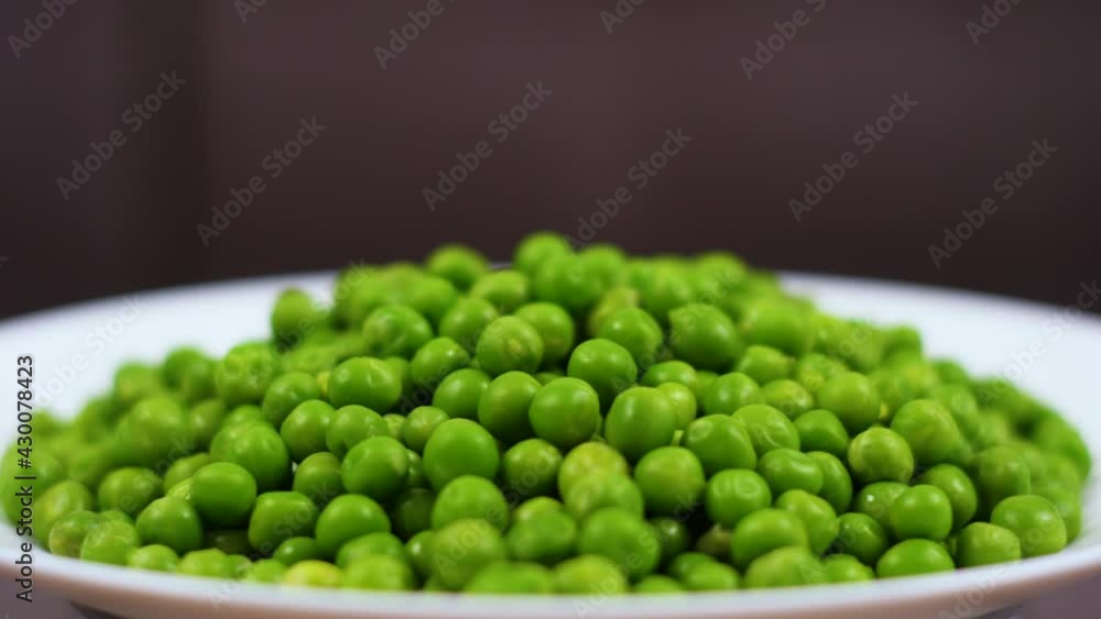 Close Up Green Peas Background Rotating. Macro Shot Fresh Organic Green Peas. Vegetable Harvest Healthy Eating. Beautiful Texture Close-up of Fresh Green Peas. Healthy Vegetarian food. Close Up Green Peas Background Rotating. Macro Shot Fresh Organic Green Peas. Vegetable Harvest Healthy Eating. Beautiful Texture Close-up of Fresh Green Peas. Healthy Vegetarian food.