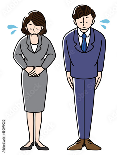 謝罪をしているビジネスマンとビジネスウーマン