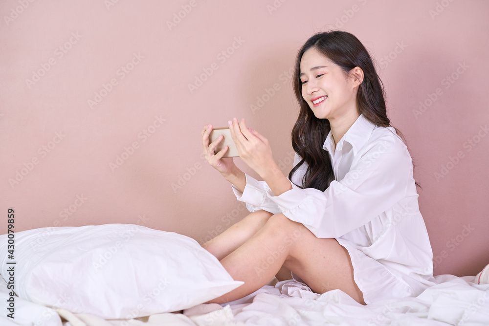 teen girl checking social media holding smartphone at home teen girl checking social media holding smartphone at home