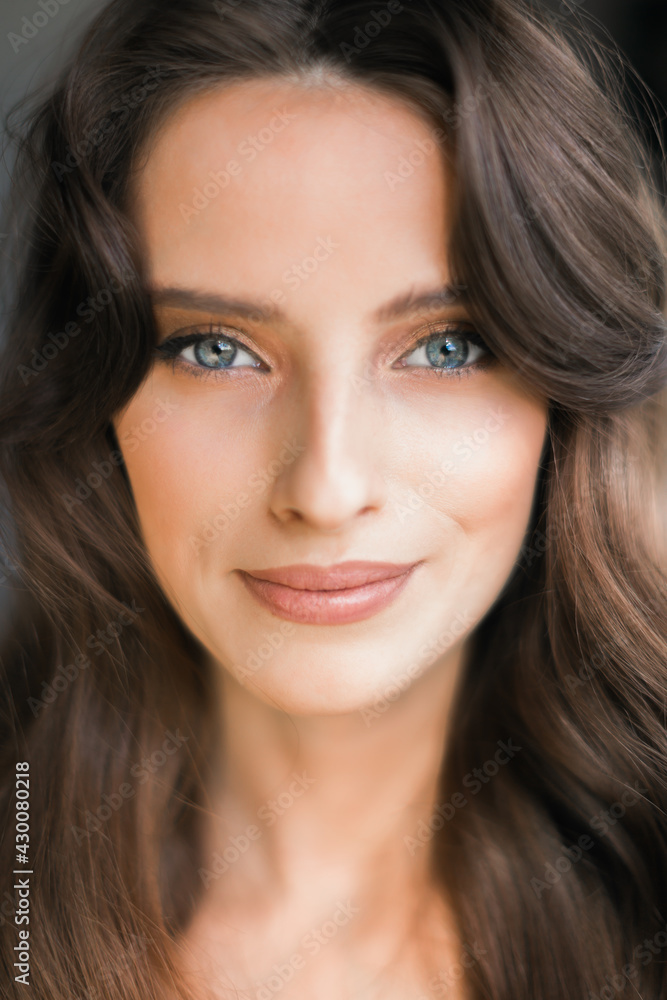 Portrait of a young brunette woman, model, looking at the camera. Portrait of a young brunette woman, model, looking at the camera.