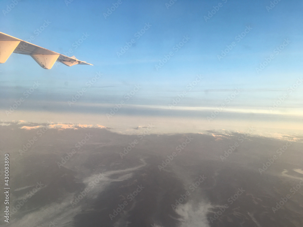 Fototapeta premium Airplane mountain view with part of wing