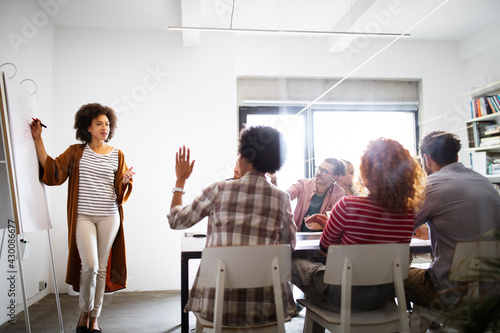 Group of people in a business meeting discussing ideas in office