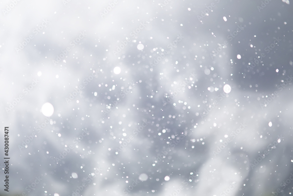 blue snowfall bokeh background, abstract snowflake background on blurred abstract blue blue snowfall bokeh background, abstract snowflake background on blurred abstract blue